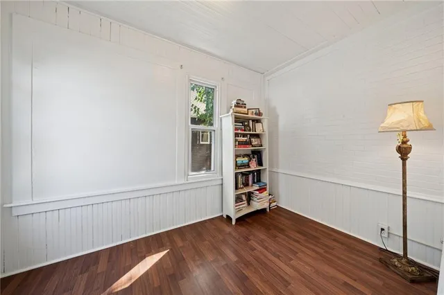 a view of wooden floor and windows in a room