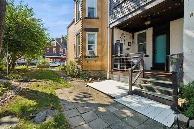 a view of house with yard