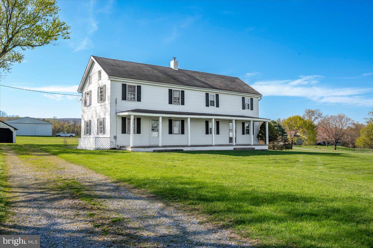 10524 Stull Road Thurmont, MD 21788 - Photo 45 of 91 a front view of a house with a garden