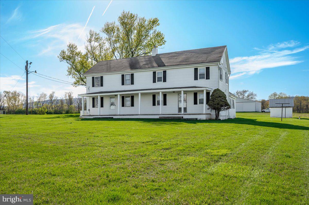 10524 Stull Road Thurmont, MD 21788 - Photo 48 of 91 a front view of a house with garden
