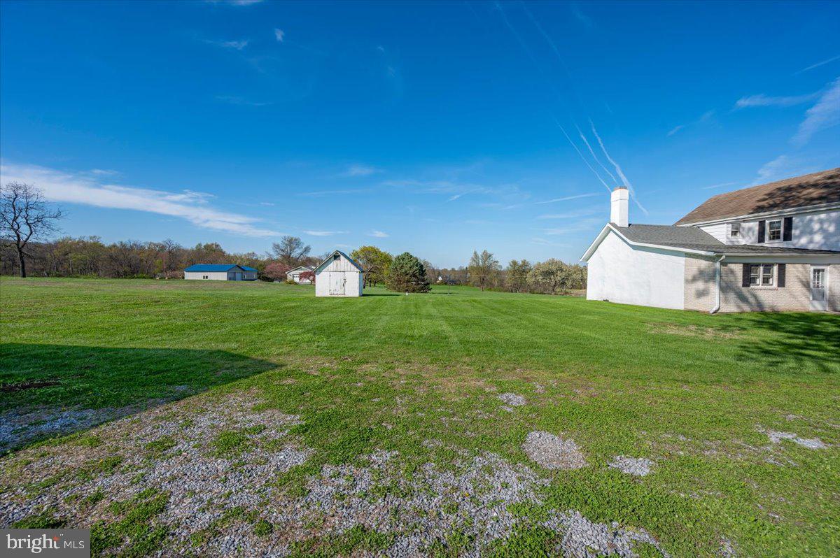 10524 Stull Road Thurmont, MD 21788 - Photo 54 of 91 a backyard of a house with lots of green space and mountain view in back