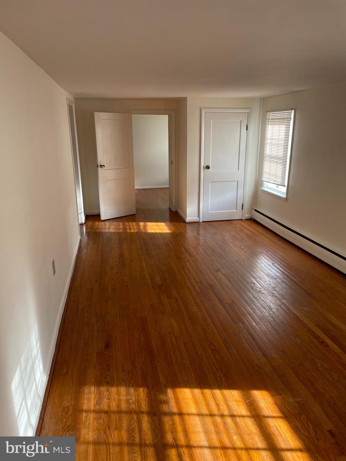 10524 Stull Road Thurmont, MD 21788 - Photo 67 of 91 wooden floor in an empty room with a window