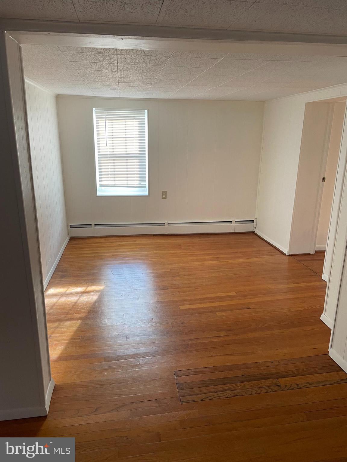 10524 Stull Road Thurmont, MD 21788 - Photo 69 of 91 a view of a room with wooden floor and window