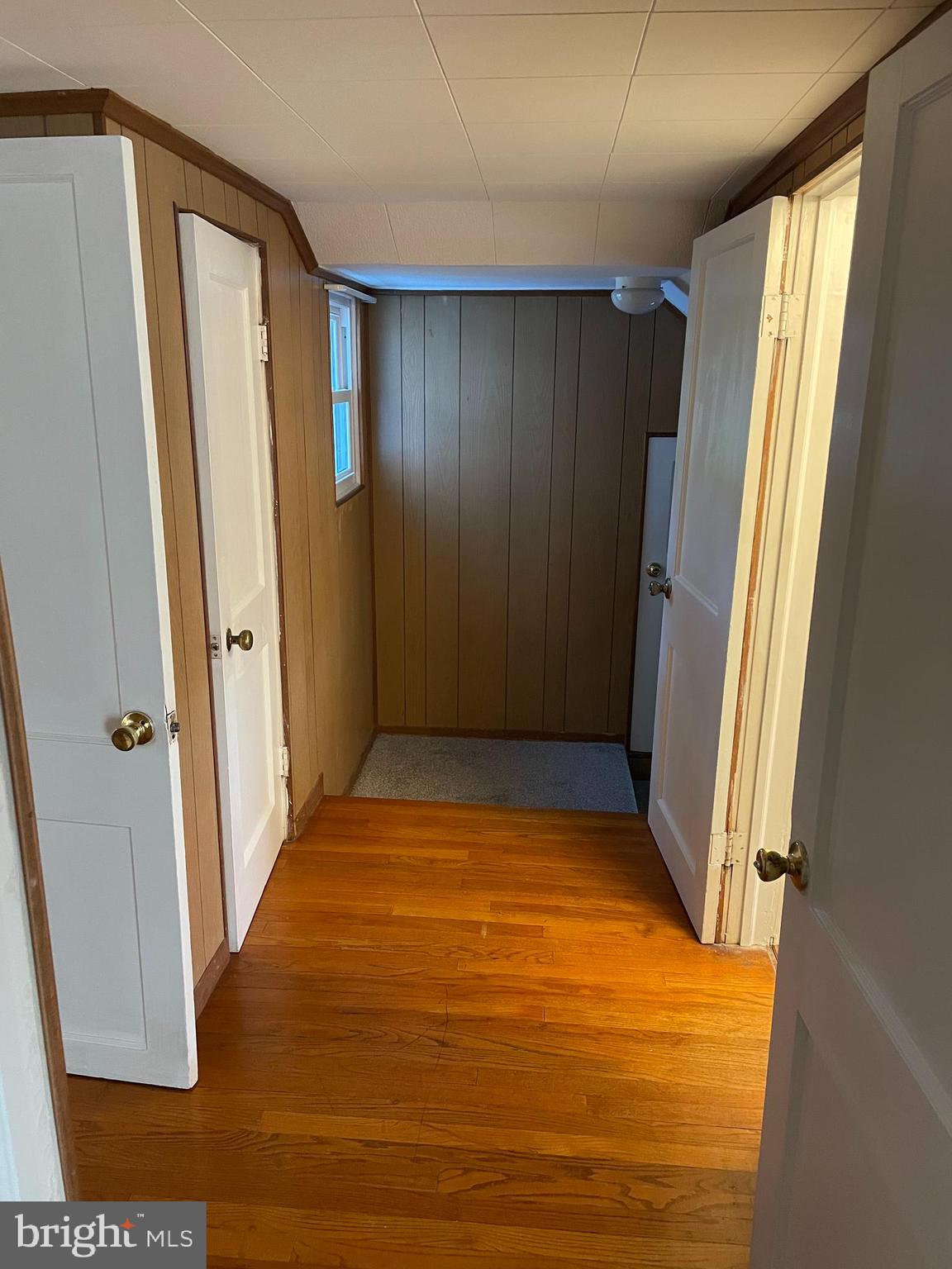 10524 Stull Road Thurmont, MD 21788 - Photo 74 of 91 a view of an empty room with wooden floor and a window