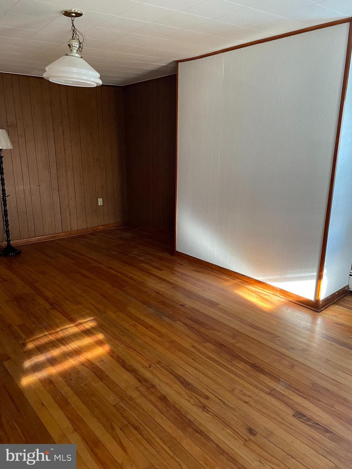 10524 Stull Road Thurmont, MD 21788 - Photo 81 of 91 a view of an empty room with wooden floor and a window