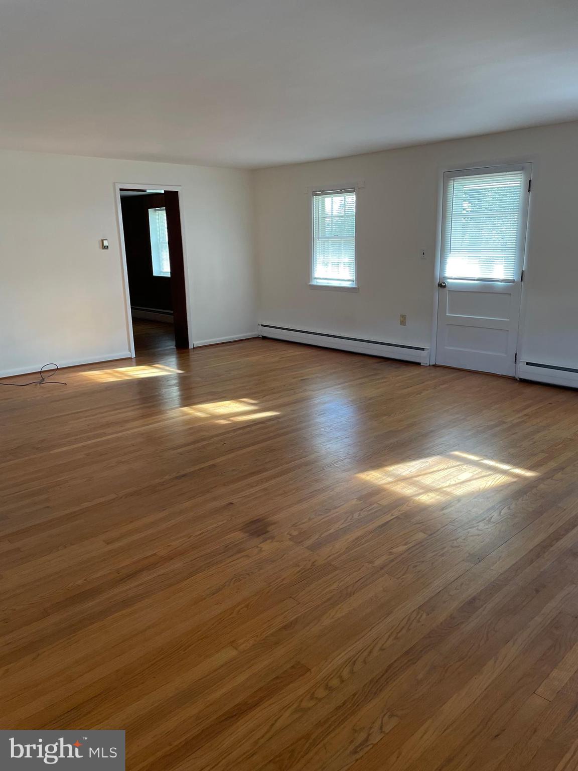 10524 Stull Road Thurmont, MD 21788 - Photo 88 of 91 a view of empty room with window and wooden floor