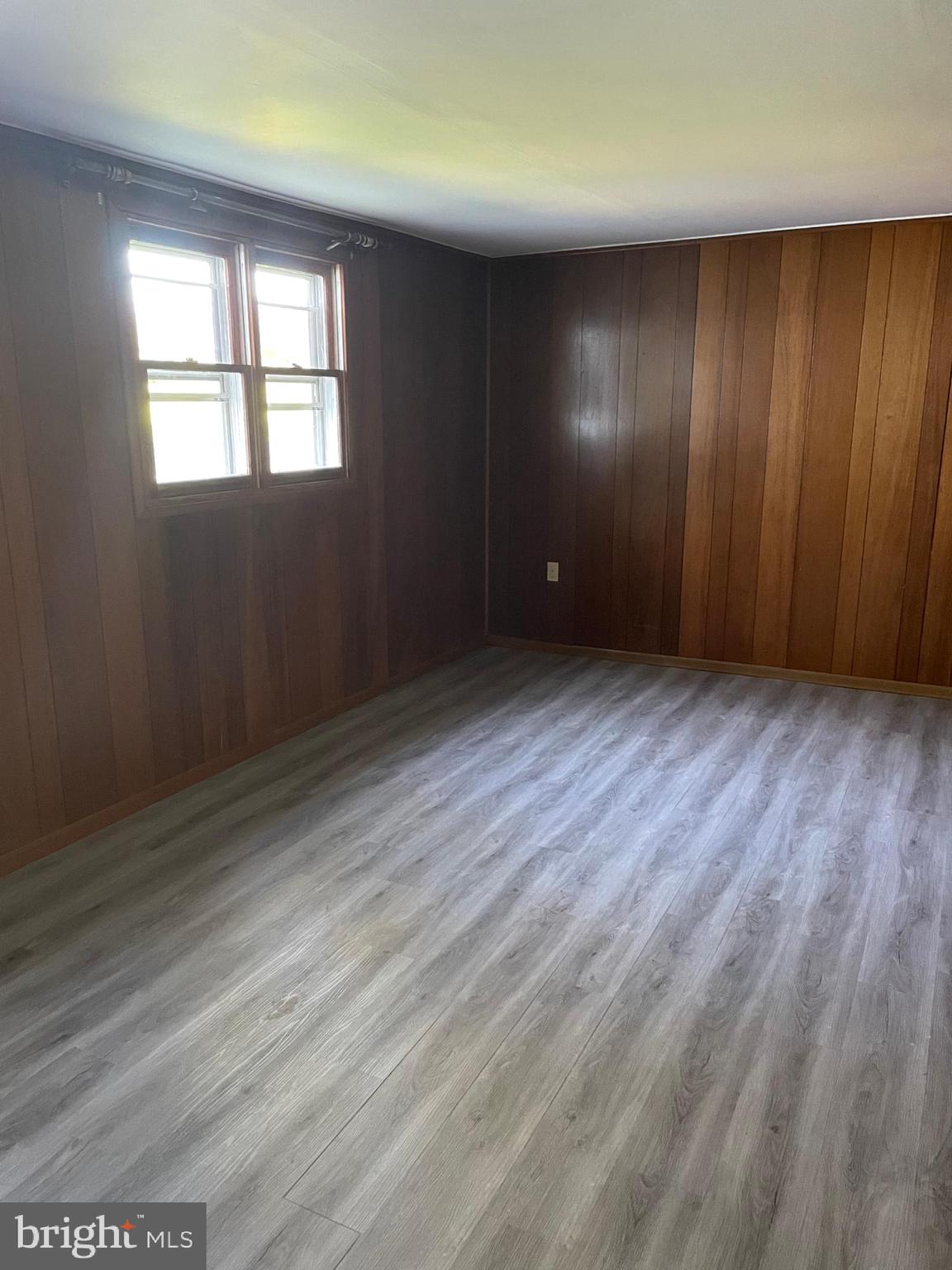 10524 Stull Road Thurmont, MD 21788 - Photo 89 of 91 an empty room with wooden floor and windows