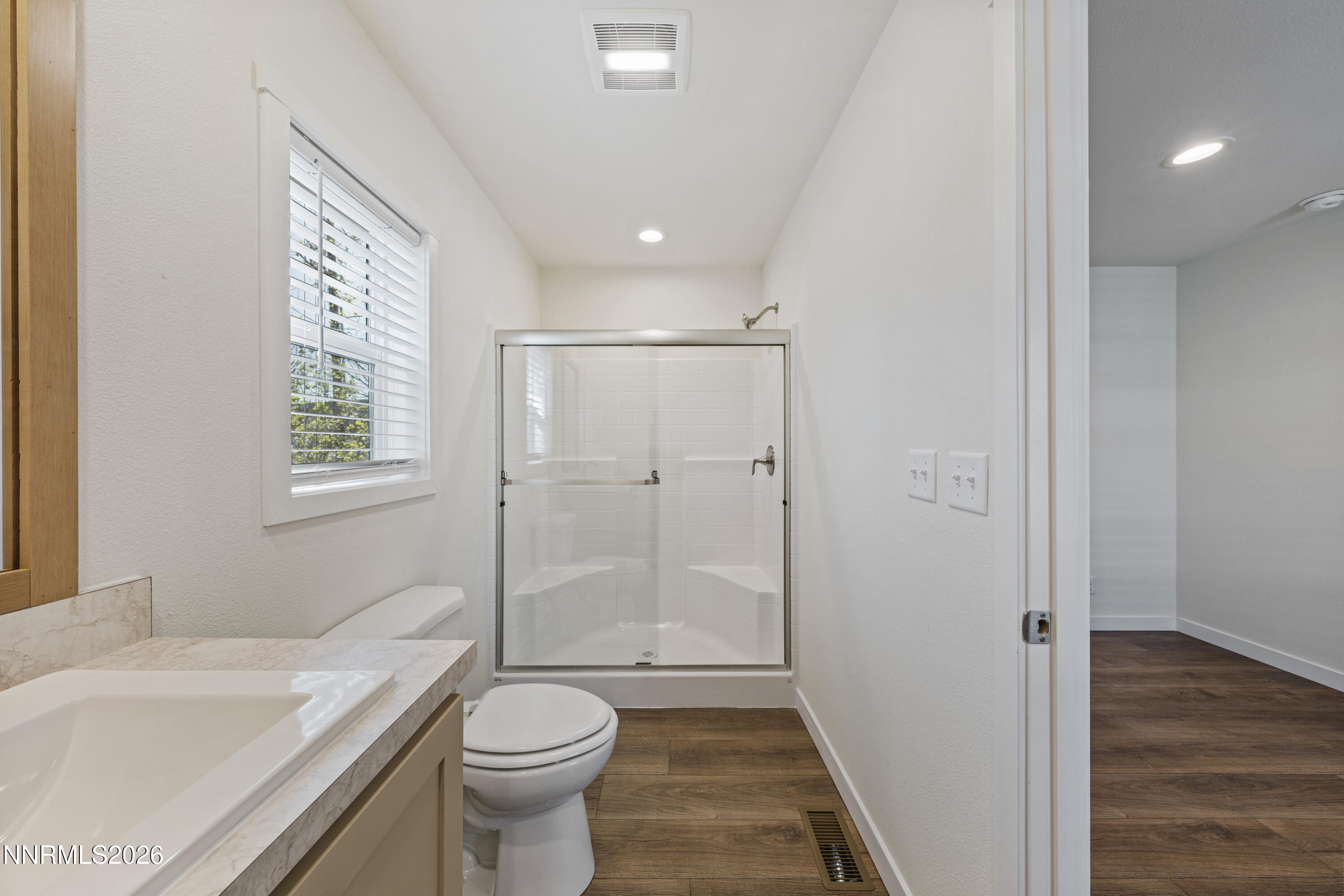 105 Fireman Row Dayton, NV 89403 - Photo 12 of 16 a bathroom with a sink a toilet and shower