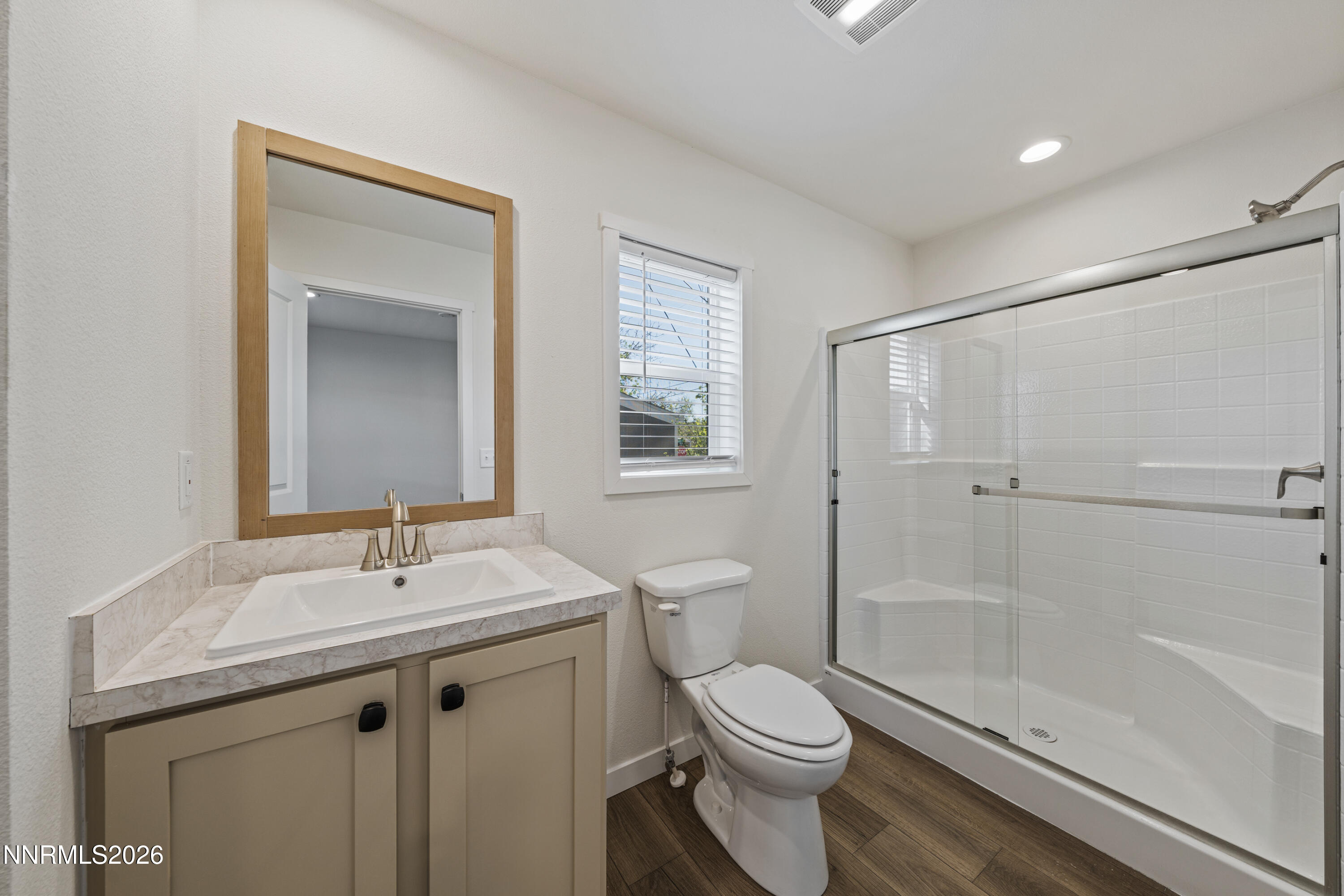 105 Fireman Row Dayton, NV 89403 - Photo 13 of 16 a bathroom with a sink a toilet and shower