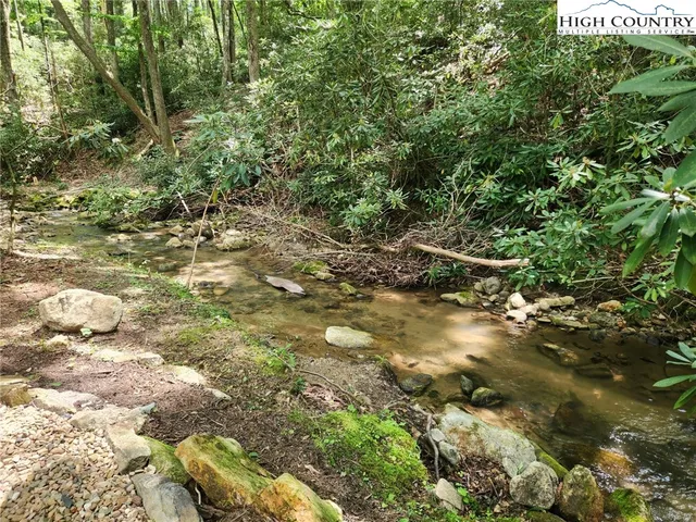 a view of a patio with a table and chairs