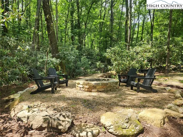 a view of outdoor space with a table and chairs
