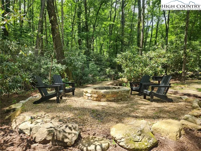 a view of outdoor space with a table and chairs