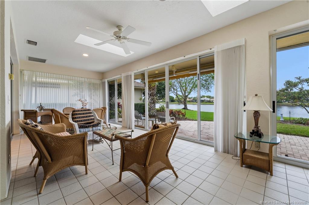 3510 Southeast Cambridge Drive Stuart, FL 34997 - Photo 23 of 38 Sliding doors enclose the covered patio with skylights