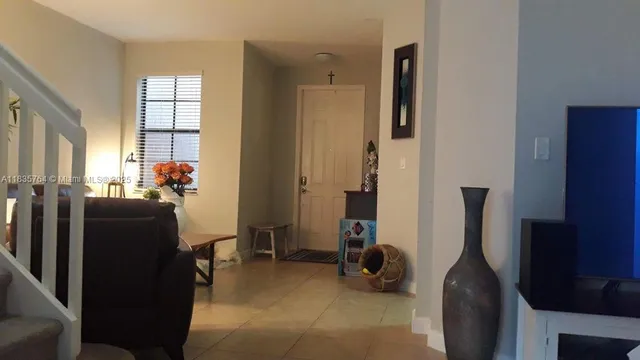 a view of a livingroom with furniture and windows