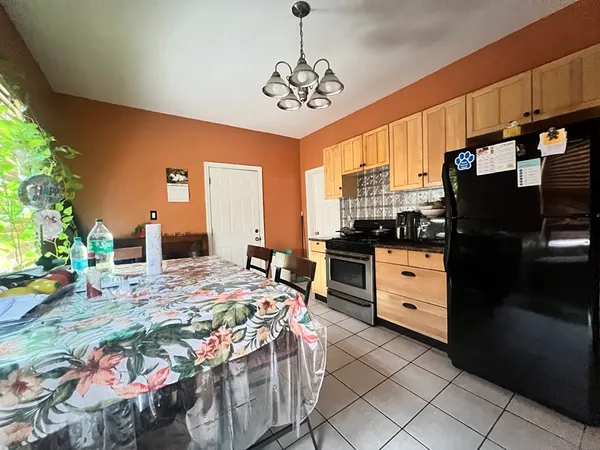 a bedroom with bed and window