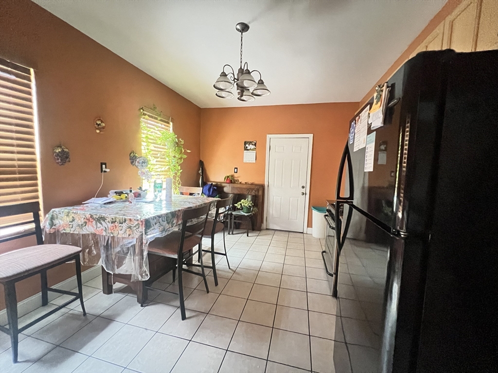 78 Addison Street, Unit B Chelsea, MA 02150 - Photo 5 of 13 a view of a dining room with furniture window and wooden floor