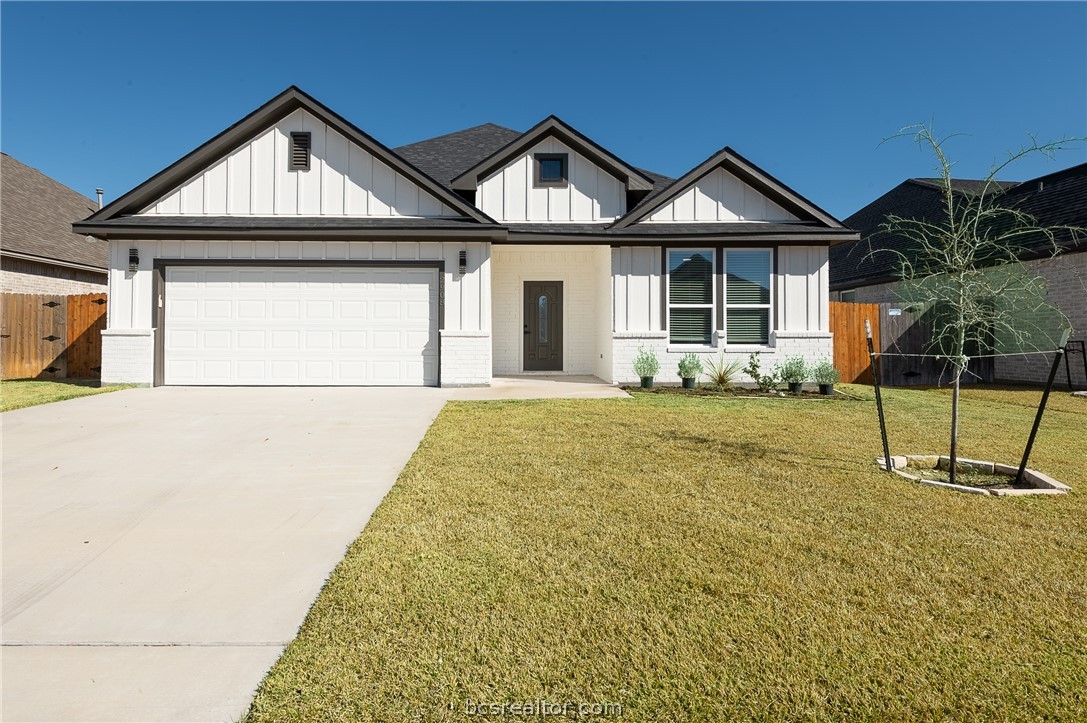 2908 GOLDBERG Drive Bryan, TX 77808 - Photo 1 of 44 Modern farmhouse style home featuring board and batten siding, brick siding, driveway, fully sodded front yard, and an attached garage