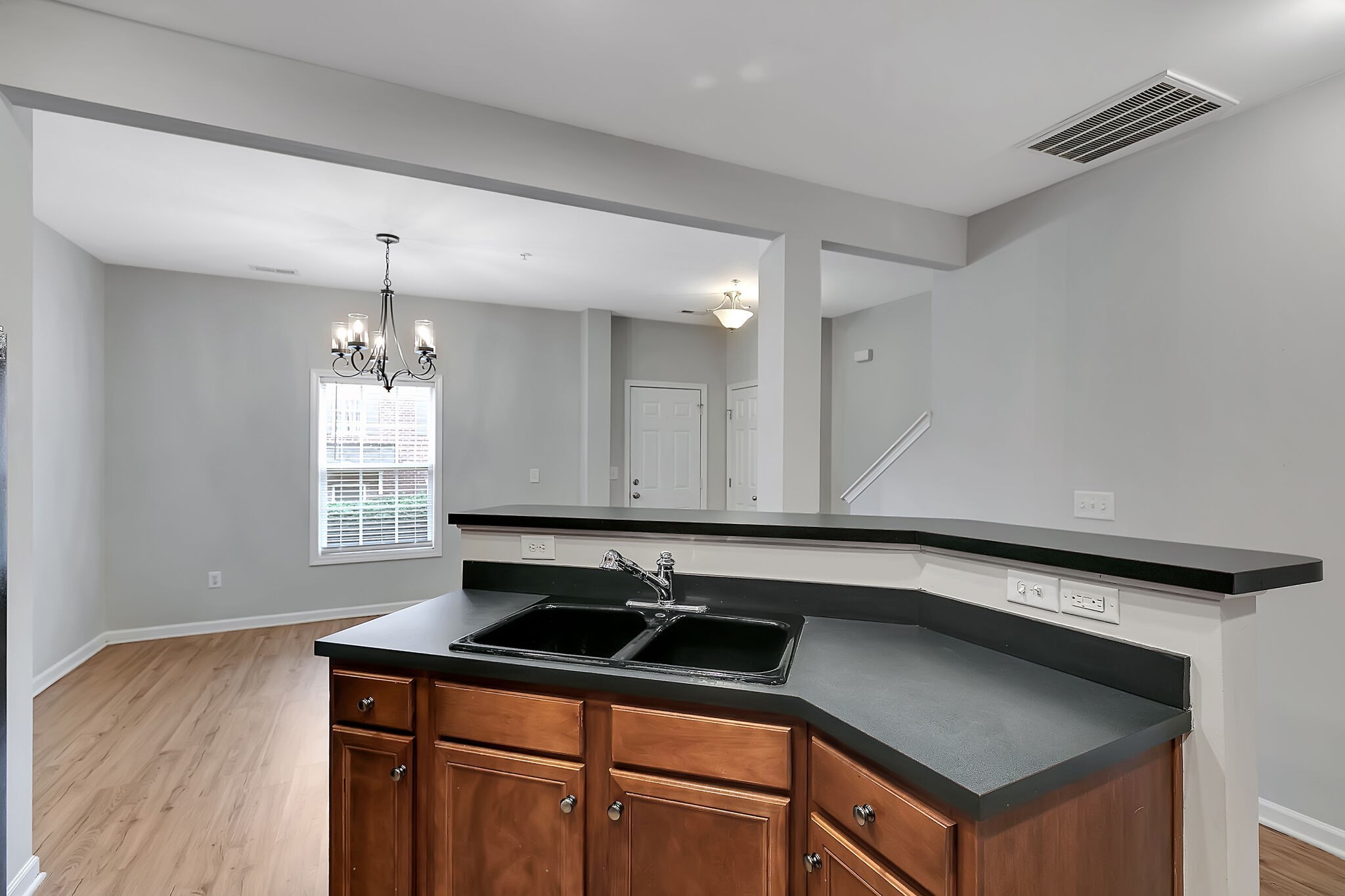 4013 Clinton Lane Spring Hill, TN 37174 - Photo 11 of 27 a kitchen with granite countertop a sink cabinets and wooden floor