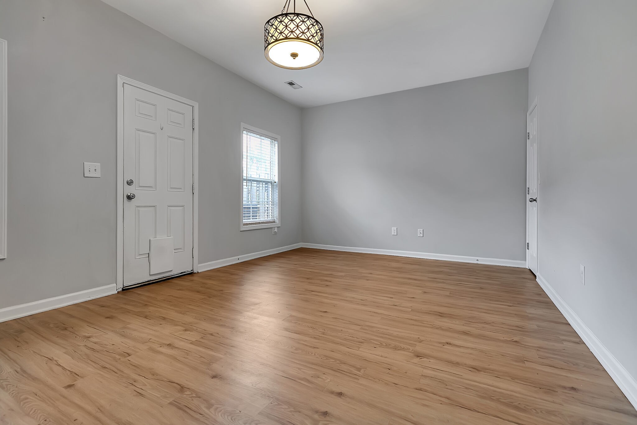4013 Clinton Lane Spring Hill, TN 37174 - Photo 12 of 27 an empty room with wooden floor and windows