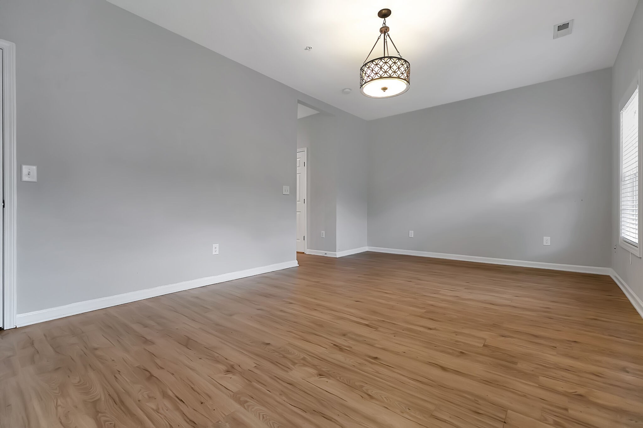 4013 Clinton Lane Spring Hill, TN 37174 - Photo 14 of 27 a view of empty room with wooden floor and fan
