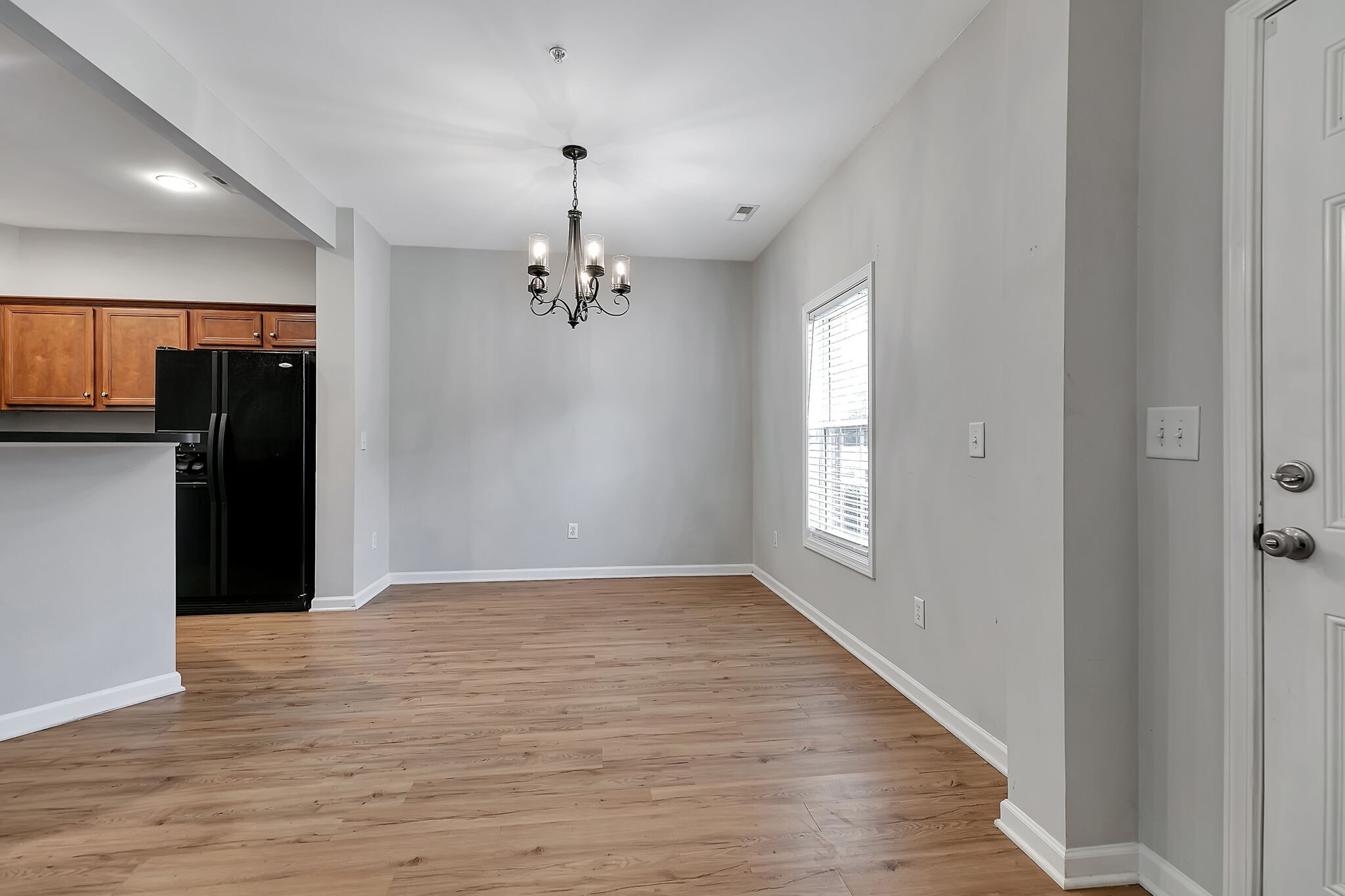 4013 Clinton Lane Spring Hill, TN 37174 - Photo 4 of 27 a view of an empty room with wooden floor and a window
