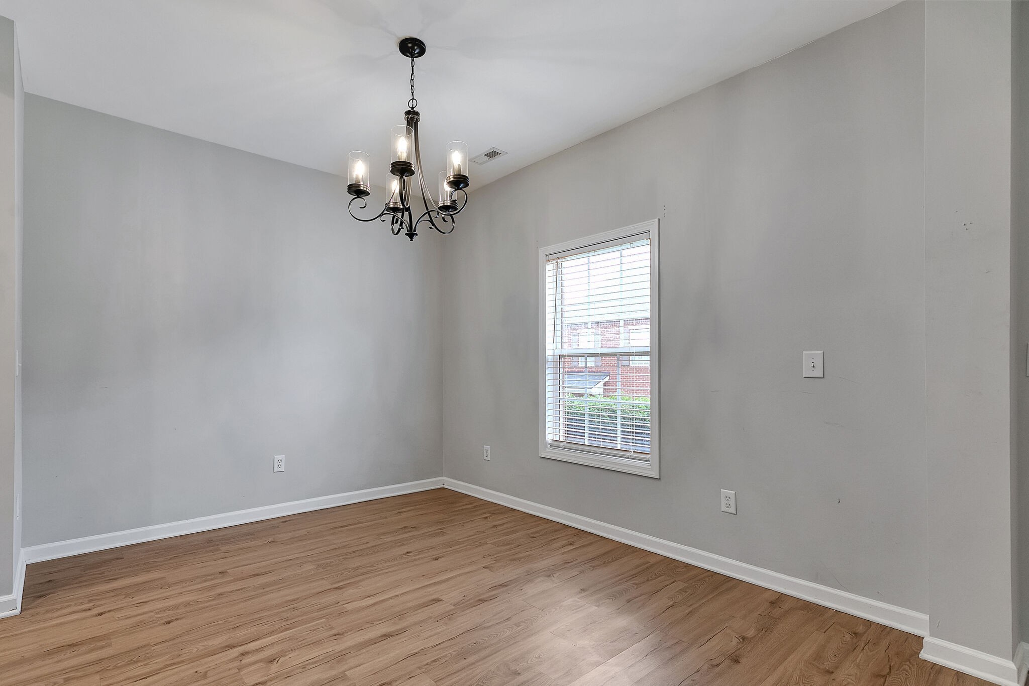 4013 Clinton Lane Spring Hill, TN 37174 - Photo 5 of 27 wooden floor in an empty room with a window