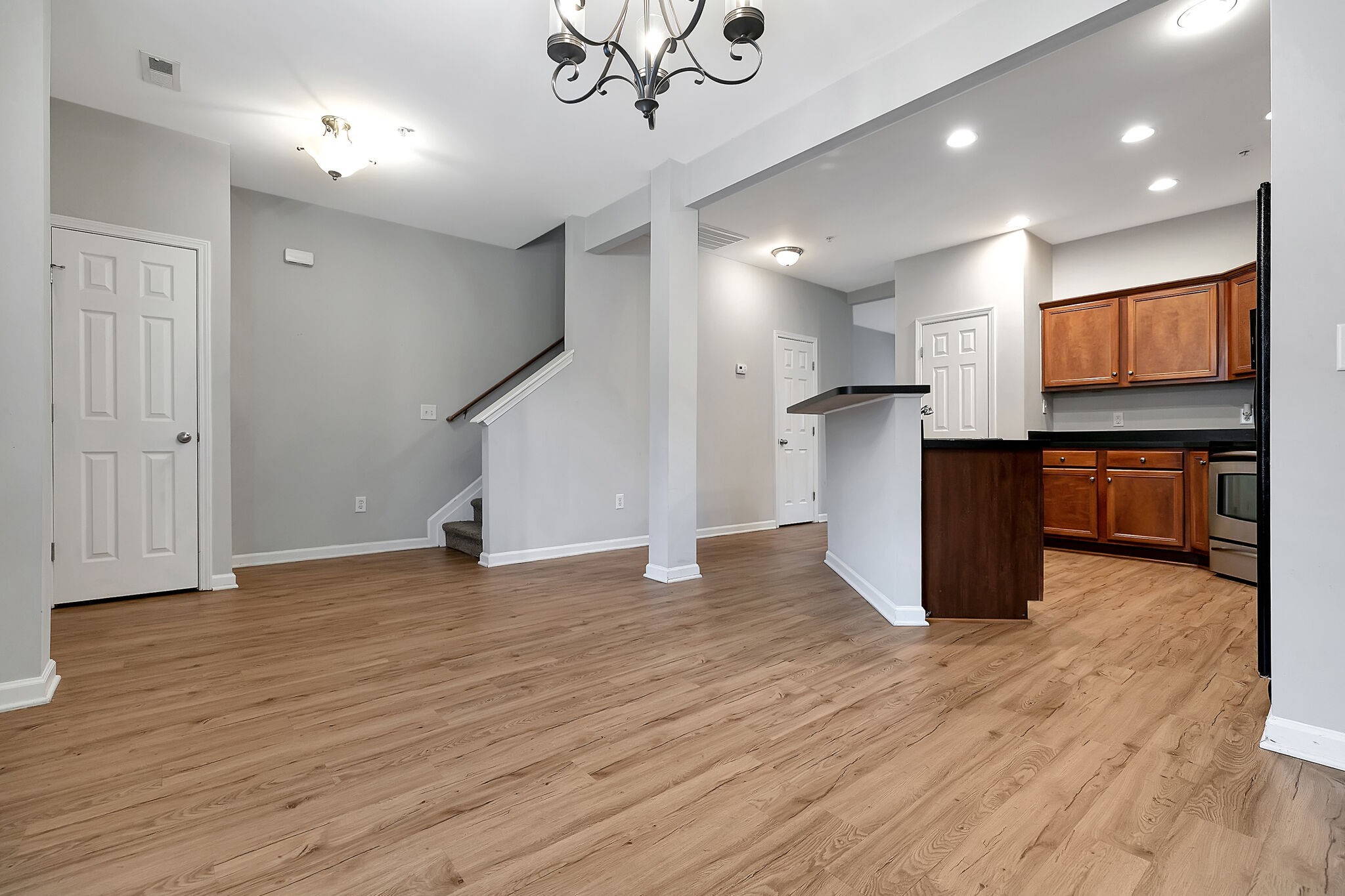 4013 Clinton Lane Spring Hill, TN 37174 - Photo 7 of 27 a view of kitchen with kitchen island microwave and wooden floor