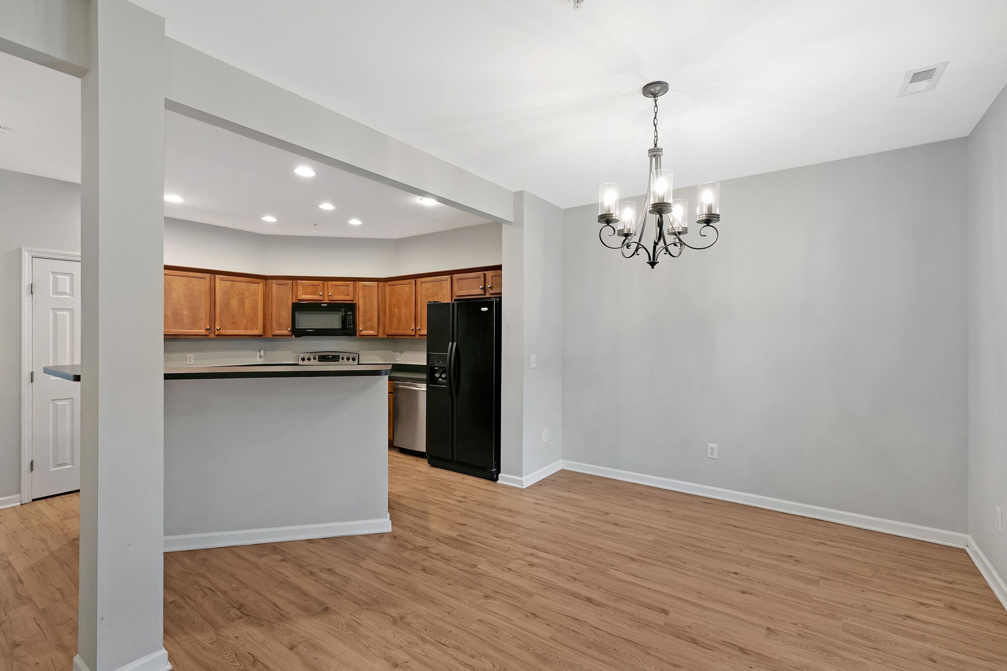 4013 Clinton Lane Spring Hill, TN 37174 - Photo 8 of 27 a view of kitchen with granite countertop cabinets and wooden floor