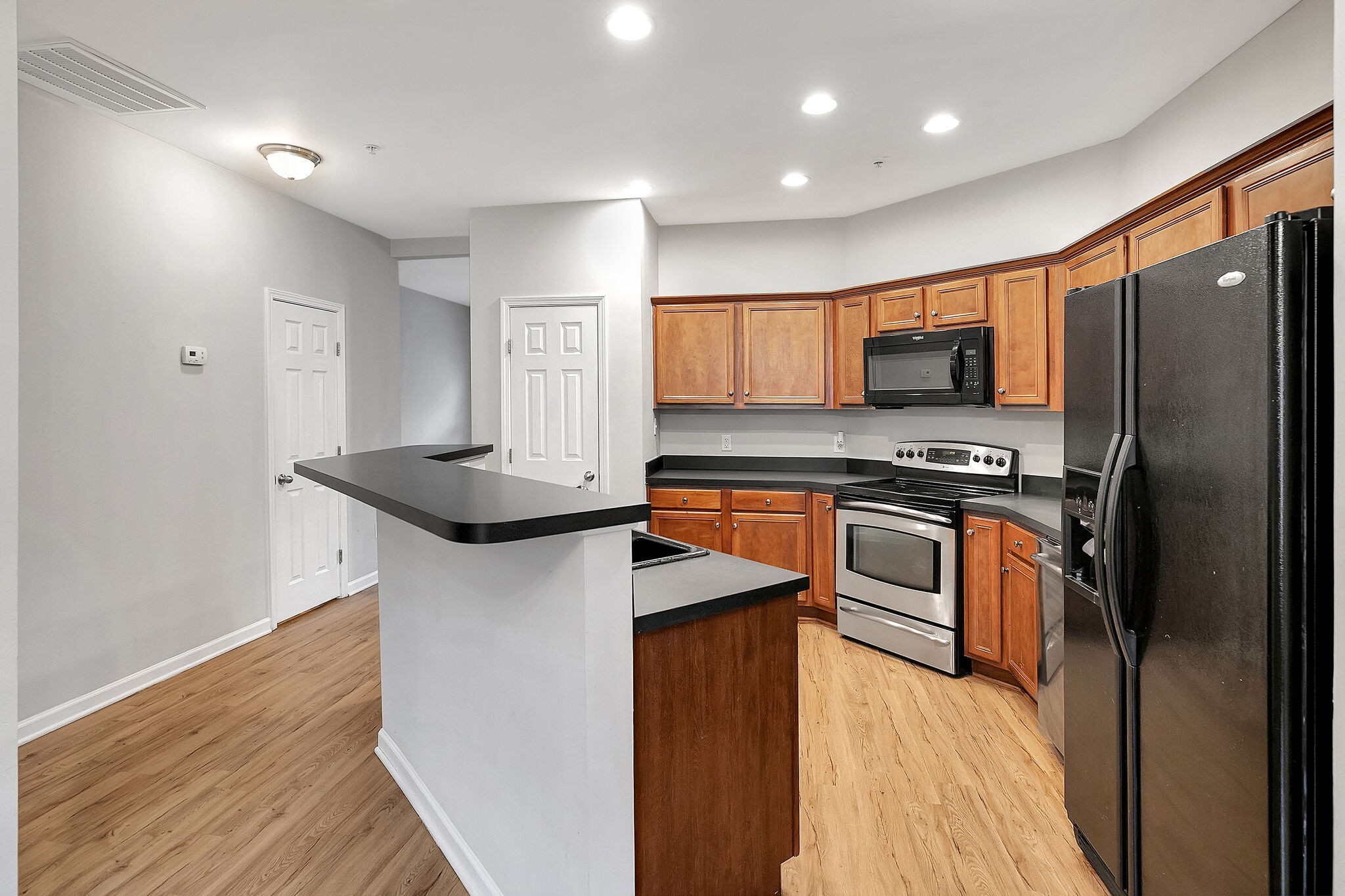 4013 Clinton Lane Spring Hill, TN 37174 - Photo 9 of 27 a kitchen with stainless steel appliances a refrigerator stove and sink