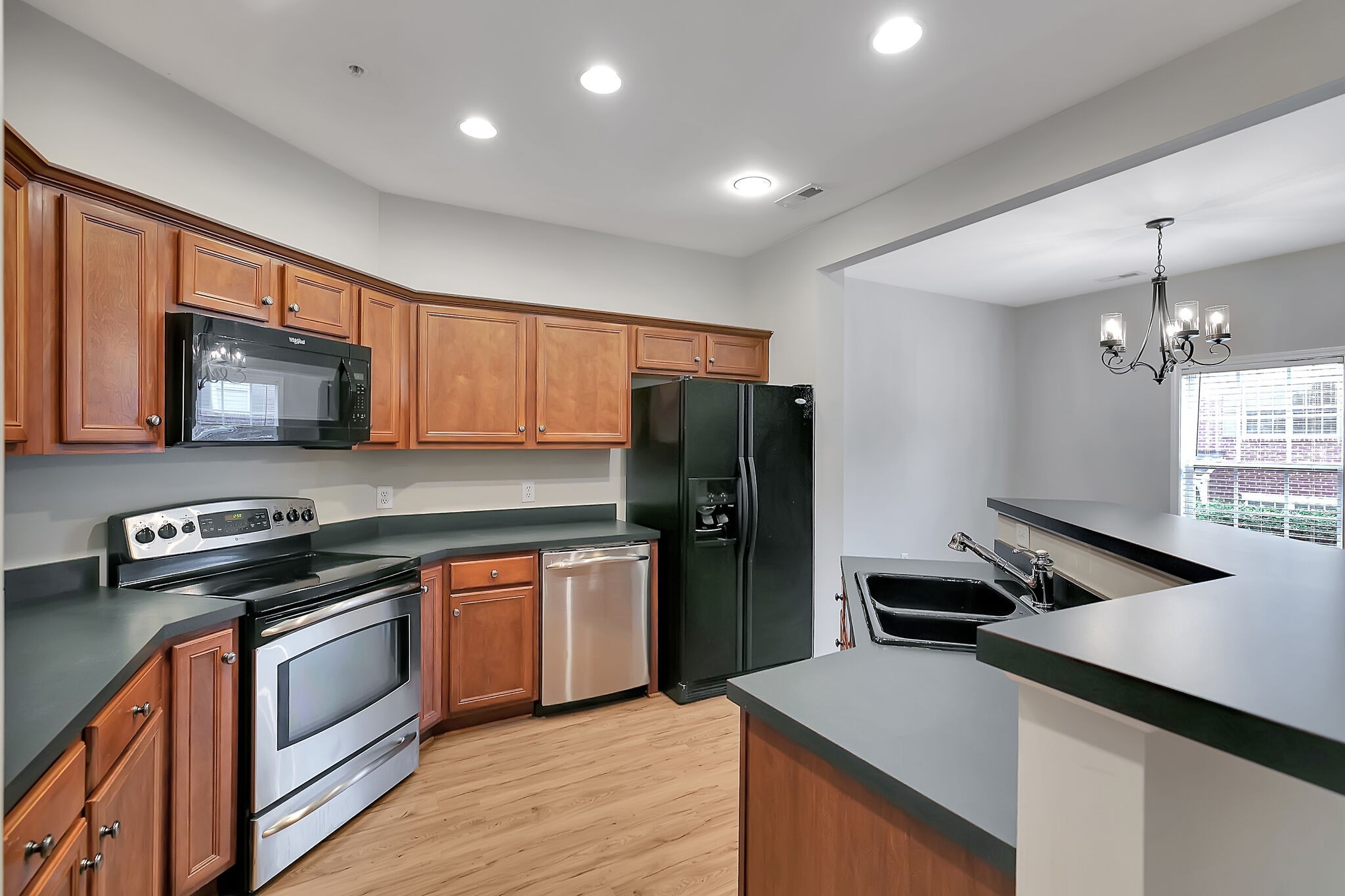 4013 Clinton Lane Spring Hill, TN 37174 - Photo 10 of 27 a kitchen with stainless steel appliances granite countertop a refrigerator stove microwave and sink