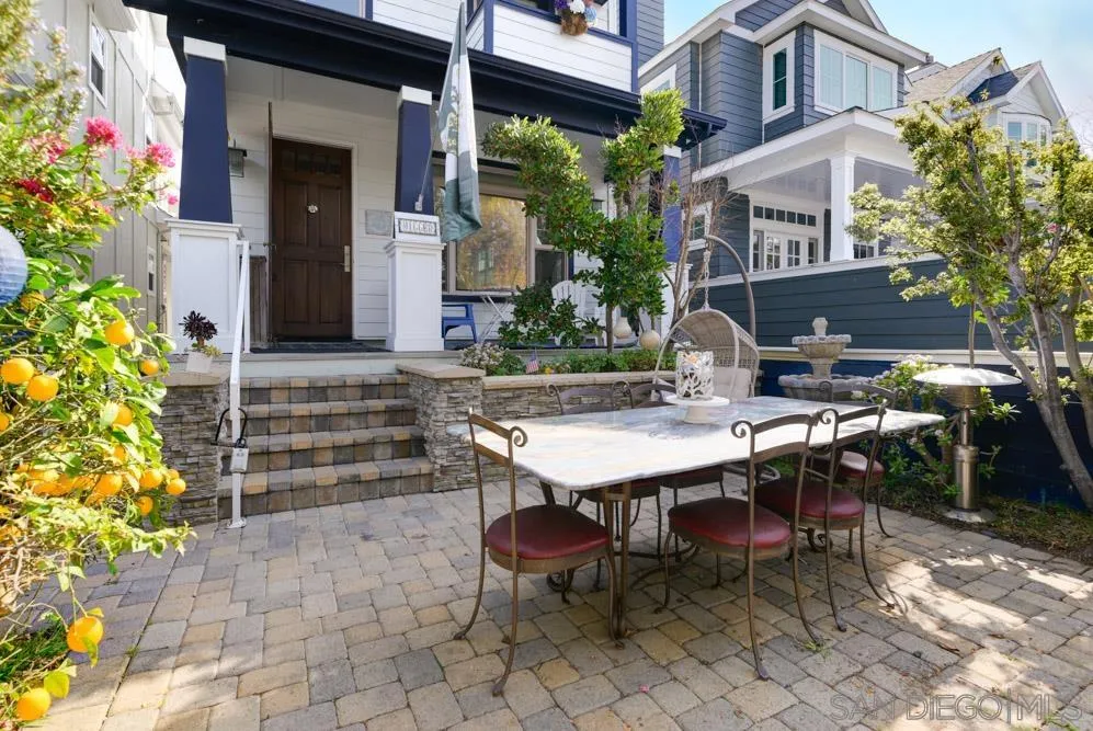 445 E Avenue Coronado, CA 92118 - Photo 2 of 25 a view of a patio with table and chairs and potted plants