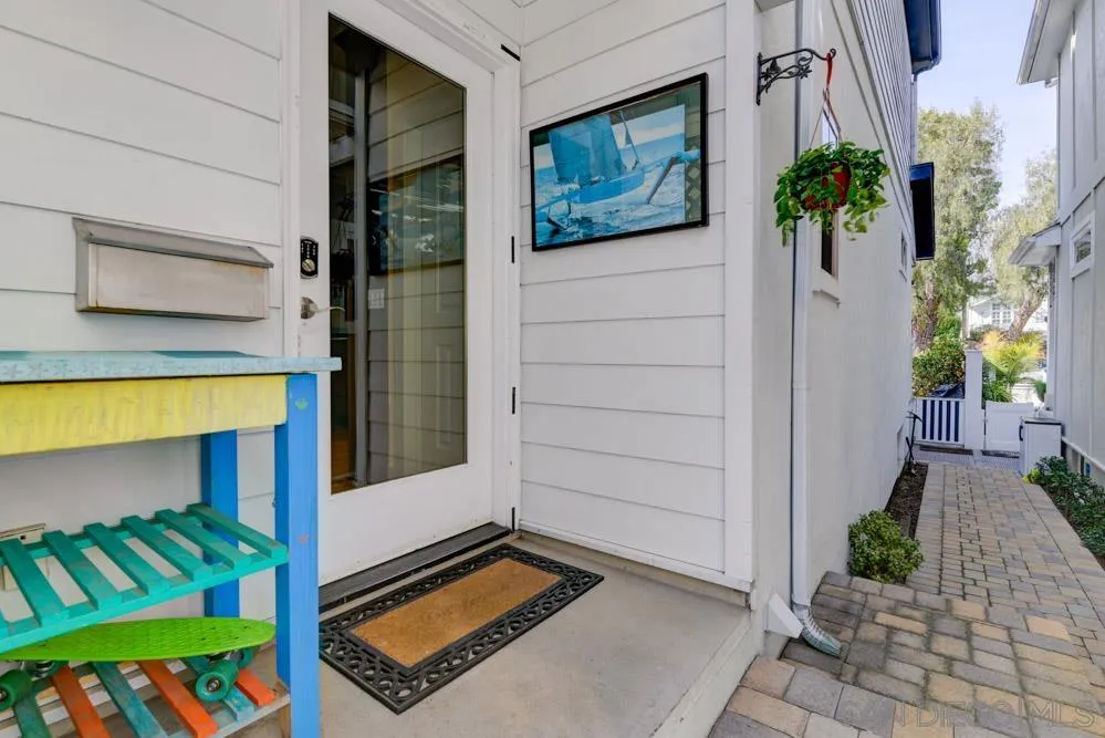 445 E Avenue Coronado, CA 92118 - Photo 23 of 25 a front view of a house with a yard