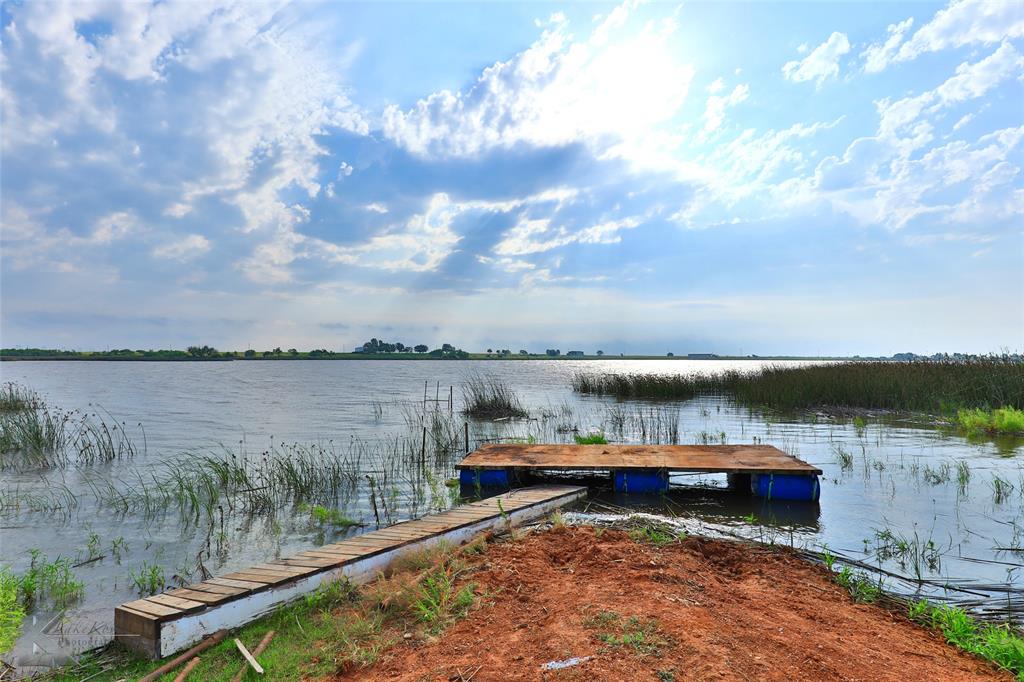 a view of lake with green space and mountain view