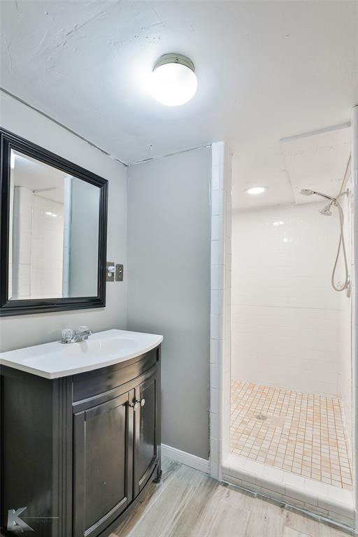 377 Grisham Road Haskell, TX 79521 - Photo 23 of 37 a bathroom with a sink vanity and a mirror