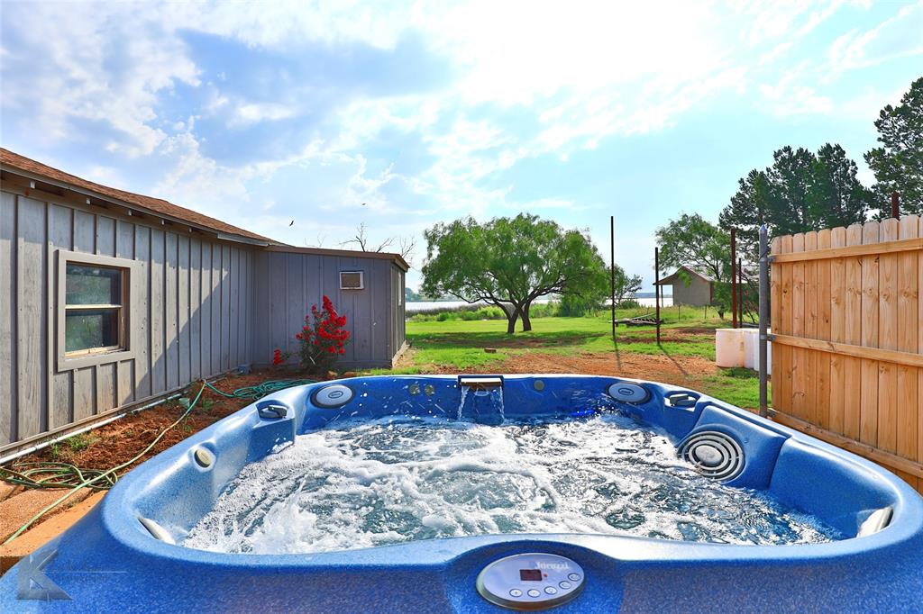 377 Grisham Road Haskell, TX 79521 - Photo 4 of 37 a view of swimming pool with a yard and sitting space