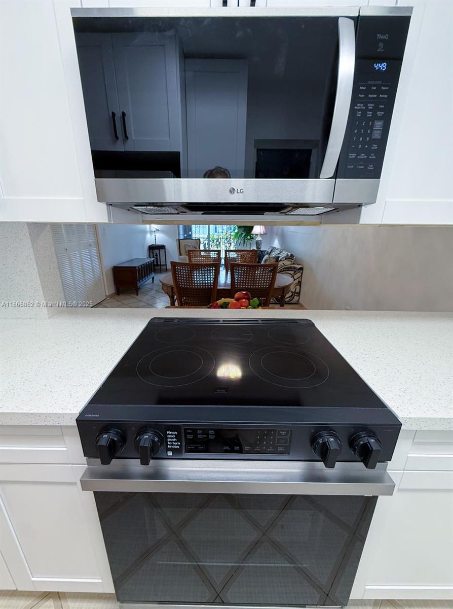 160 Southwest 30th Avenue, Unit 109A Miami, FL 33135 - Photo 6 of 9 a close view of stove