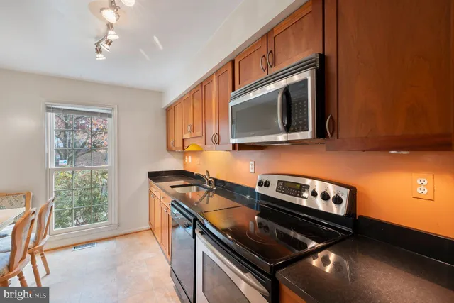 a kitchen with a stove and a microwave
