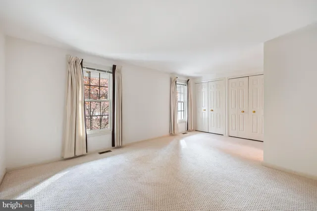 an empty room with windows