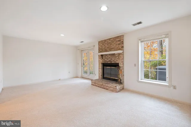 an empty room with fireplace