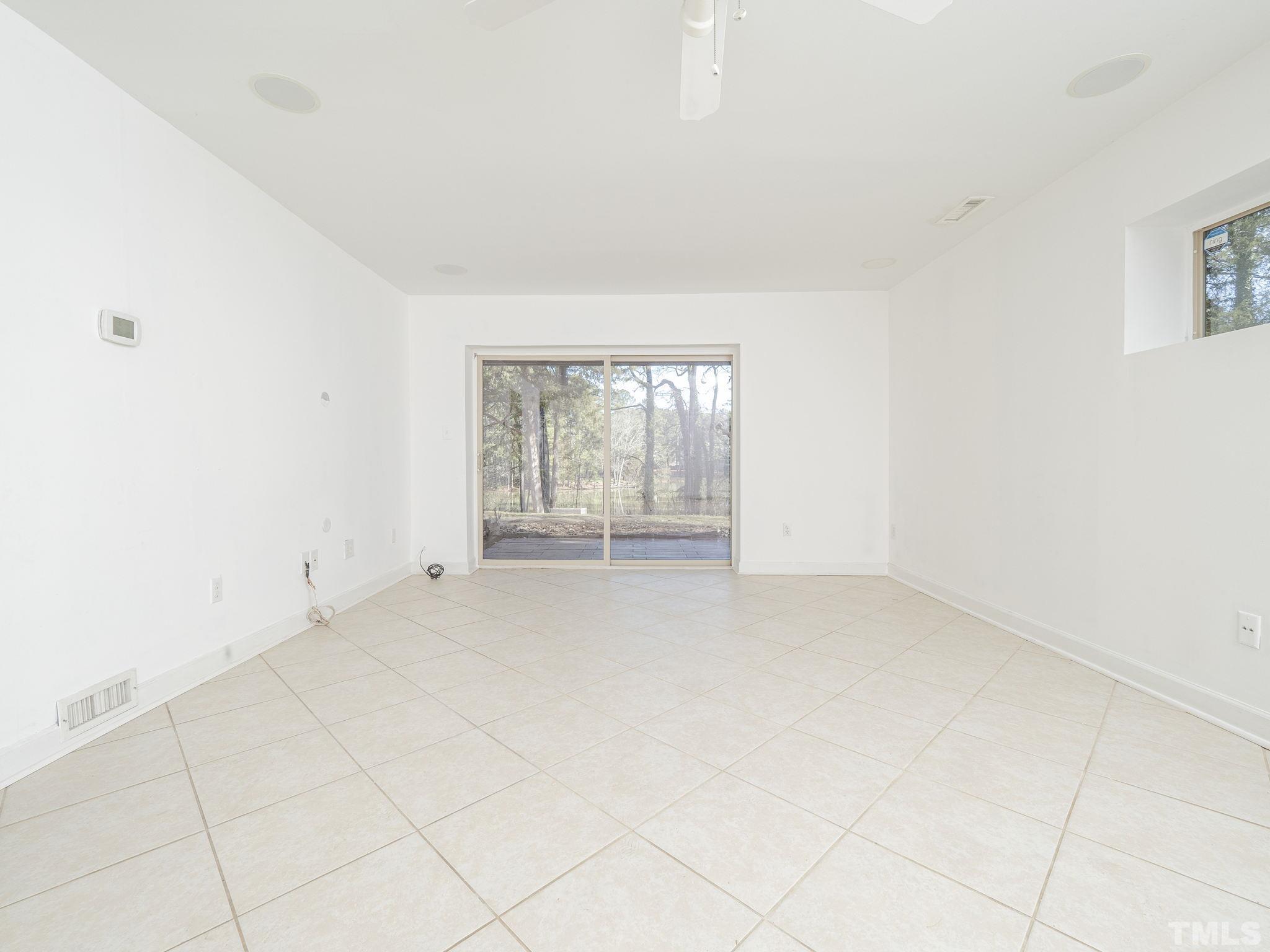 5072 Flint Ridge Place, Unit 5072 Raleigh, NC 27609 - Photo 4 of 18 an empty room with windows