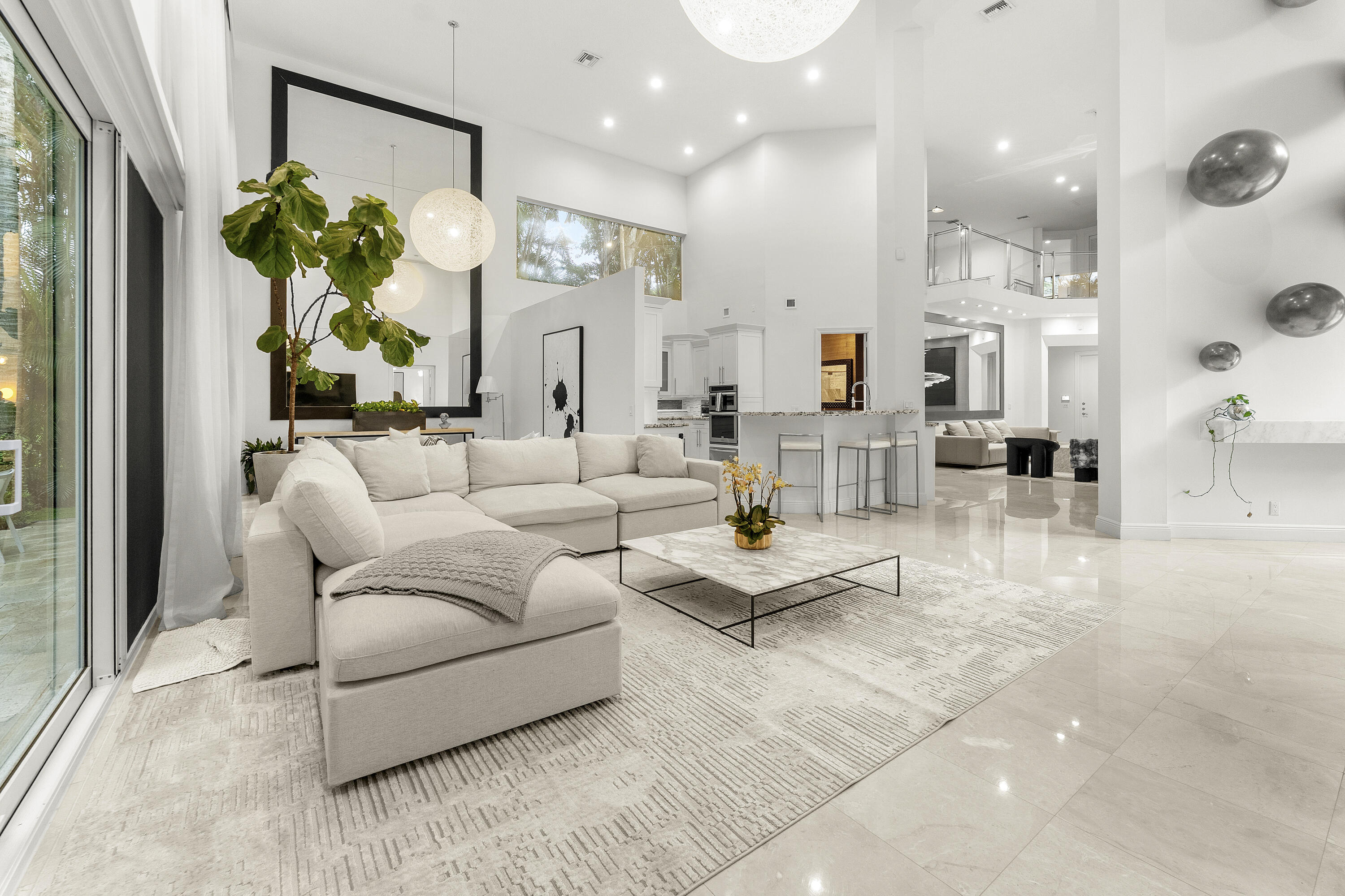 3156 Northwest 61st Street Boca Raton, FL 33496 - Photo 6 of 46 a living room with furniture and a large window
