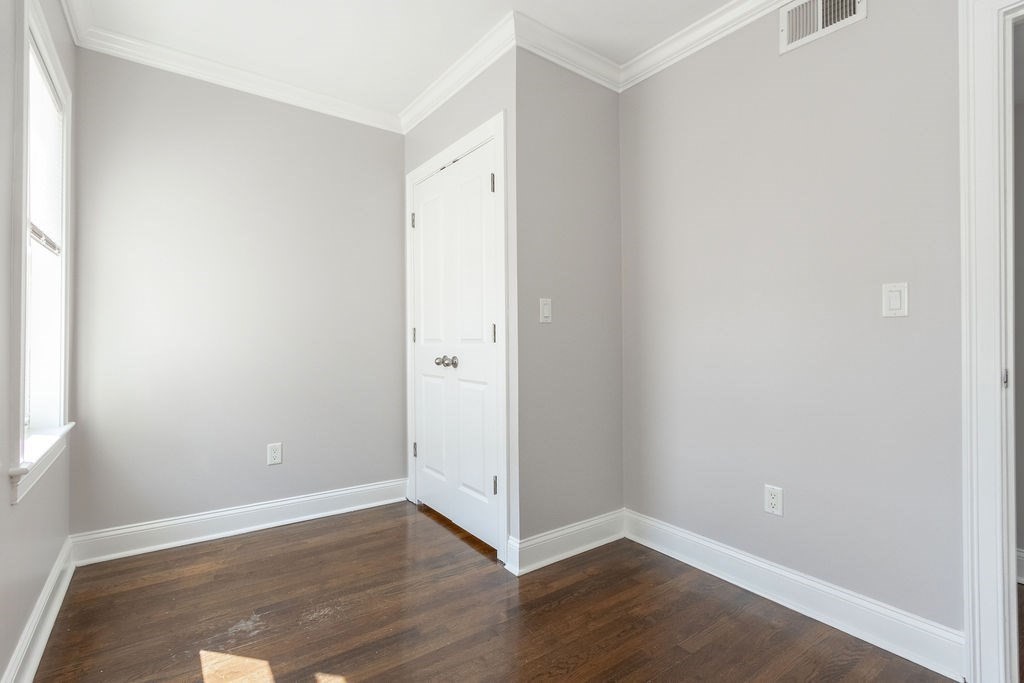 40 Stellman Road, Unit 32 Boston, MA 02131 - Photo 13 of 20 a view of an empty room with wooden floor