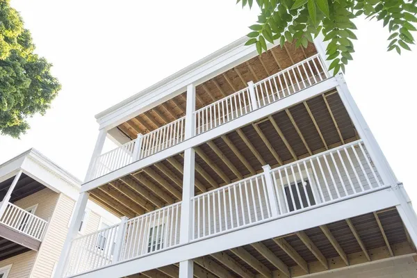 a view of balcony with wooden floor