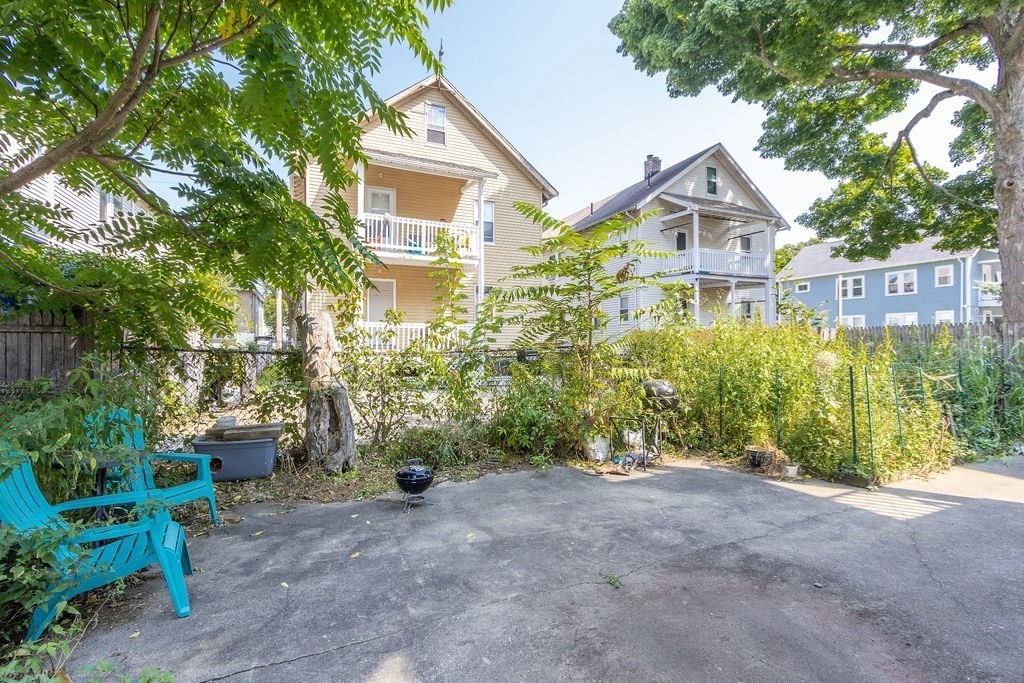 40 Stellman Road, Unit 32 Boston, MA 02131 - Photo 20 of 20 a view of a house with a yard and plants