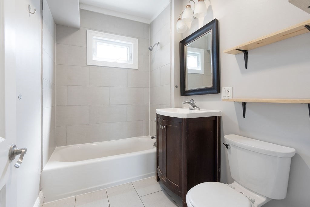 40 Stellman Road, Unit 32 Boston, MA 02131 - Photo 6 of 20 a bathroom with a sink toilet and shower