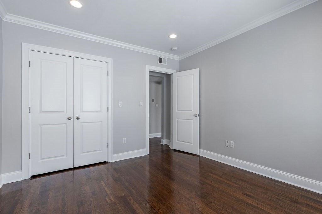 40 Stellman Road, Unit 32 Boston, MA 02131 - Photo 8 of 20 a view of an empty room with wooden floor