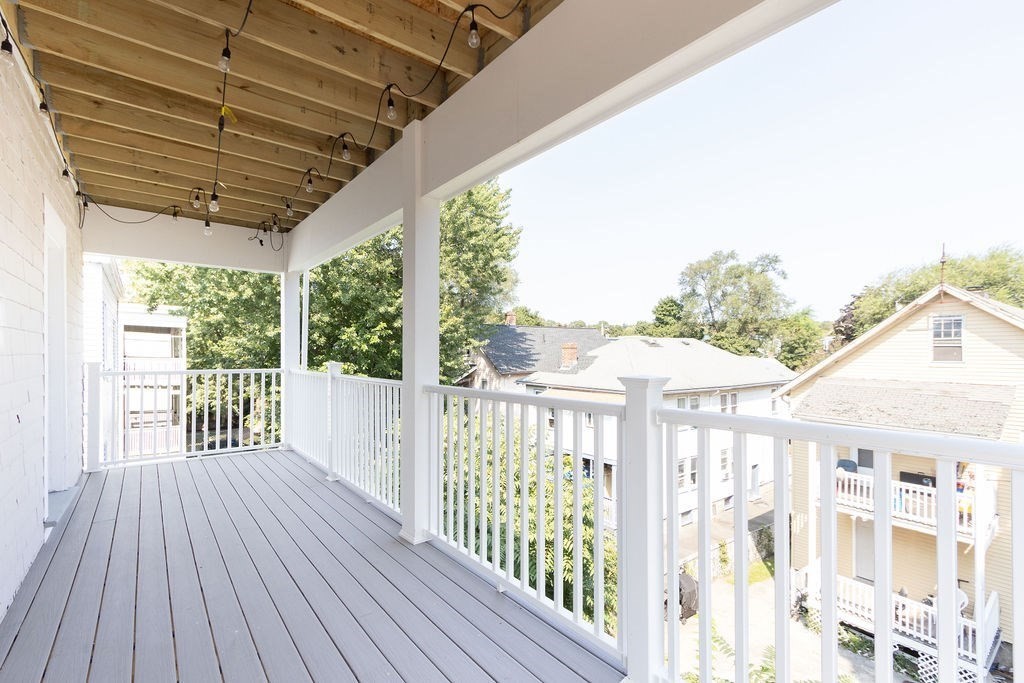 40 Stellman Road, Unit 32 Boston, MA 02131 - Photo 9 of 20 a view of a porch with wooden floor and outdoor space