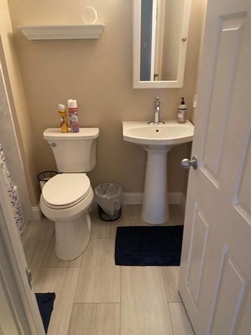 45 Main Street, Unit 221 Wareham, MA 02571 - Photo 12 of 36 a bathroom with a sink toilet and a mirror