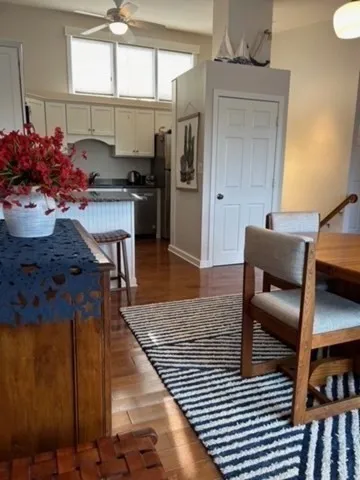 a living room with stainless steel appliances kitchen island granite countertop furniture and a kitchen view