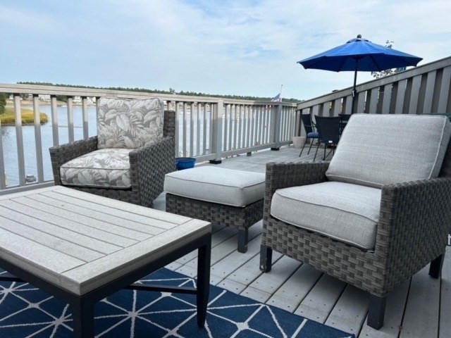45 Main Street, Unit 221 Wareham, MA 02571 - Photo 29 of 36 a balcony with a table and chairs